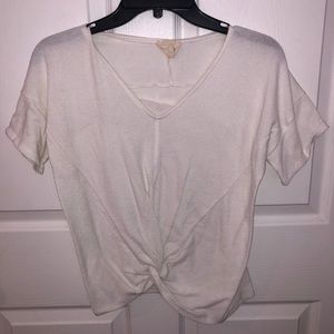 White top with tie at bottom